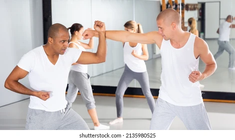 concentrated men practicing basic moves 260nw 2135980525