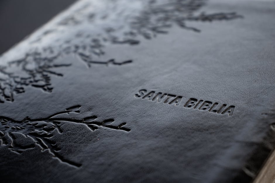 Close-up shot of a Santa Biblia with intricate debossed leather design, capturing religious essence.