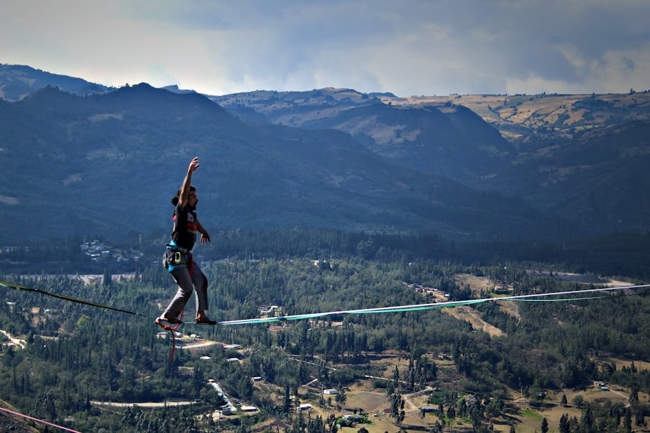 A person walking on a slackline against stunning Sutatausa mountains in Colombia.